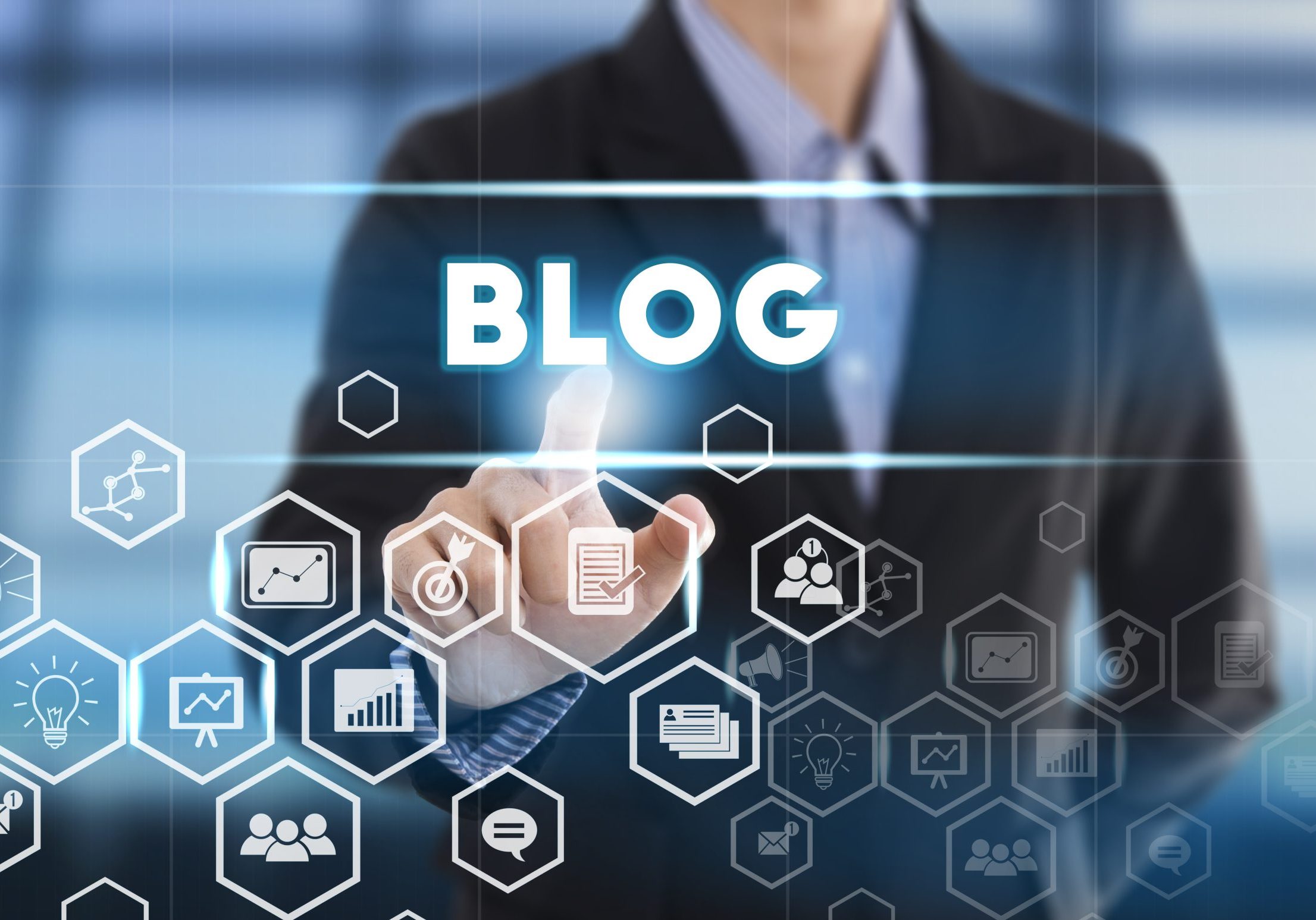 Businessman hand chooses blog wording on interface screen. internet technology concept. can used for cover page presentation and web banner.